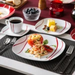 MALACASA Felisa red stripe dinnerware set arranged on a dining table