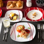 MALACASA Felisa red stripe dinnerware set arranged on a dining table