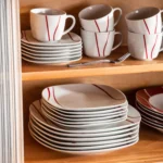 MALACASA Felisa red stripe dinnerware set arranged on a dining table