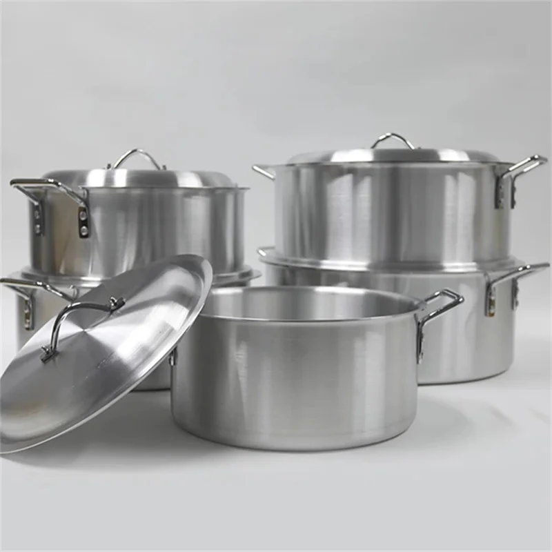 5-piece non-stick cookware set with pots, pans, and utensils on a kitchen counter