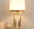 Modern table lamp with fabric shade in a cozy living room setting