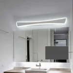 Modern wall sconce with white iron and acrylic shade in a contemporary bathroom