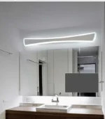 Modern wall sconce with white iron and acrylic shade in a contemporary bathroom