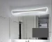 Modern wall sconce with white iron and acrylic shade in a contemporary bathroom