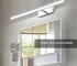 Modern bathroom vanity light with adjustable LED bars in a stylish bathroom setting