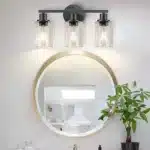 Modern bathroom vanity light with matte black iron body and glass shade, warm white LED glow