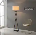 Modern floor lamp with iron frame and fabric shade in a contemporary living room