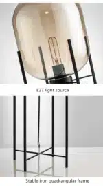Modern floor lamp with iron frame and glass shade in a cozy living room