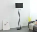 Modern floor lamp with iron frame and fabric shade in a contemporary living room