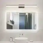Modern black vanity light with LED bar illuminating a bathroom mirror