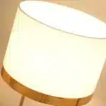 Modern table lamp with fabric shade in a cozy living room setting