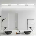 Modern black vanity light with LED bar illuminating a bathroom mirror