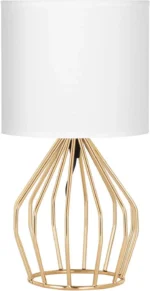 Modern gold table lamp with linen shade on bedside table in bedroom