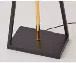 Modern floor lamp with iron frame and fabric shade in a contemporary living room