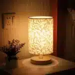 Modern linen table lamp with USB port and touch control on bedside table