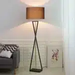Modern floor lamp with iron frame and fabric shade in a contemporary living room