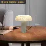 Elegant marble table lamp with soft glow on bedside table in bedroom