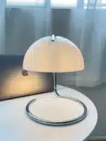 Modern table lamp with mushroom shade in a cozy bedroom
