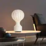 Wabi sabi floor lamp with textured fabric shade in a cozy living room corner