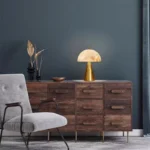Elegant marble table lamp with soft glow on bedside table in bedroom