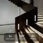 Motion sensor stair lights recessed in wooden steps glowing warm white