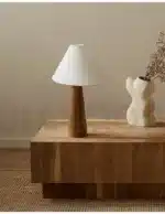 Conical oak floor lamp with wabi-sabi style in a cozy living room