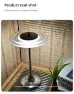 Goldoma rechargeable table lamp with flying saucer shape and warm glow on a bedside table