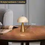 Elegant marble table lamp with soft glow on bedside table in bedroom