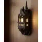 Castle wall lamp illuminating a cozy bedroom corner with warm light