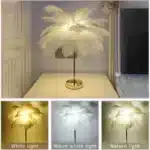 Ostrich feather table lamp glowing warmly on a bedside table in a cozy bedroom