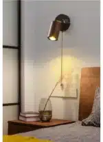 Walnut bedside wall light with adjustable spotlight and zipper switch in a cozy bedroom