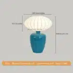 Vintage table lamp with retro ceramic base and silk shade on bedside table in cozy bedroom