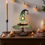 Witch hat lamp with stained glass pattern casting a warm glow on a bedside table