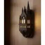 Castle wall lamp illuminating a cozy bedroom corner with warm light