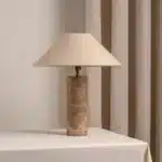 Modern marble LED table lamp with white fabric shade on wooden desk