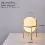 Modern table lamp with wood and glass base, minimalist design for bedroom or living room