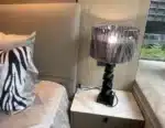 Modern crystal floor lamp with black finish and LED light in a living room