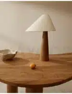 Conical oak floor lamp with wabi-sabi style in a cozy living room