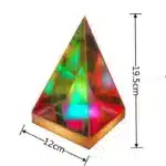 3D pyramid night light with RGB color modes on a bedside table