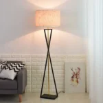 Modern floor lamp with iron frame and fabric shade in a contemporary living room