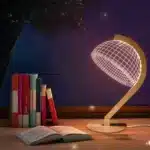 3D LED table lamp with wooden base and acrylic art glowing in a cozy room