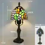 Tiffany table lamp with colorful stained glass shade casting warm glow on nightstand