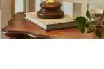 Vintage desk lamp with stained glass butterfly shade casting warm glow on bedside table