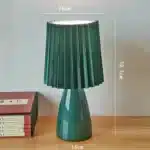 Milkshake bedside table lamp with warm LED light on a nightstand in a cozy bedroom