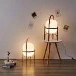Modern table lamp with wood and glass base, minimalist design for bedroom or living room