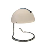 Modern table lamp with mushroom shade in a cozy bedroom