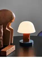 Nordic retro mushroom table lamp with warm LED glow on a bedside table
