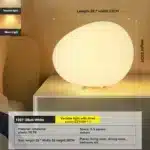 Modern table lamp with warm glow on bedside table