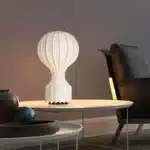 Wabi sabi floor lamp with textured fabric shade in a cozy living room corner