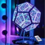 Dodecahedron gaming light with vibrant RGBW colors illuminating a gaming desk setup